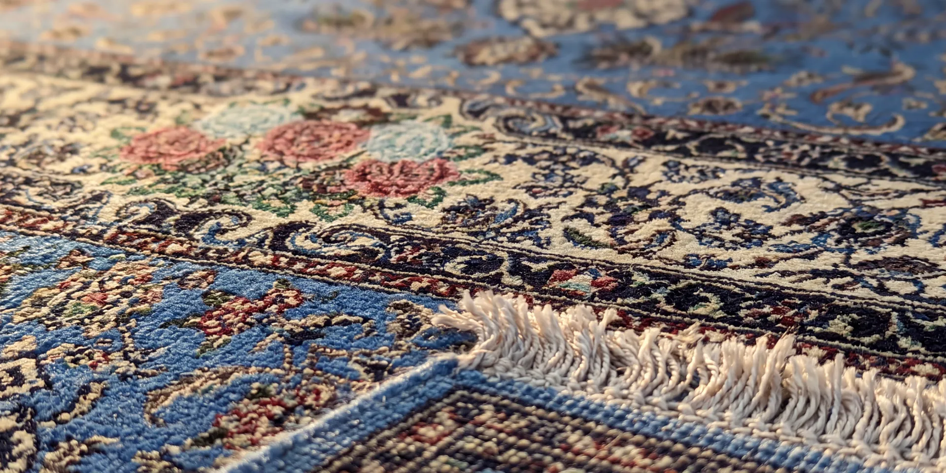A macro view of a fine Isfahan weave on a silk foundation