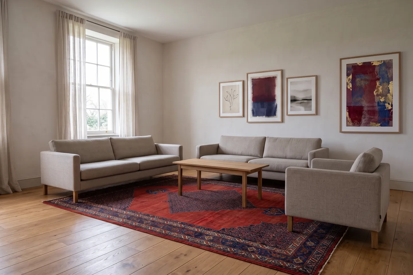 The same room with a rug running under the front legs of the seating